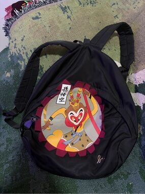 Agnes. B Black Backpack with Graphic Monkey King and Maroon Trim